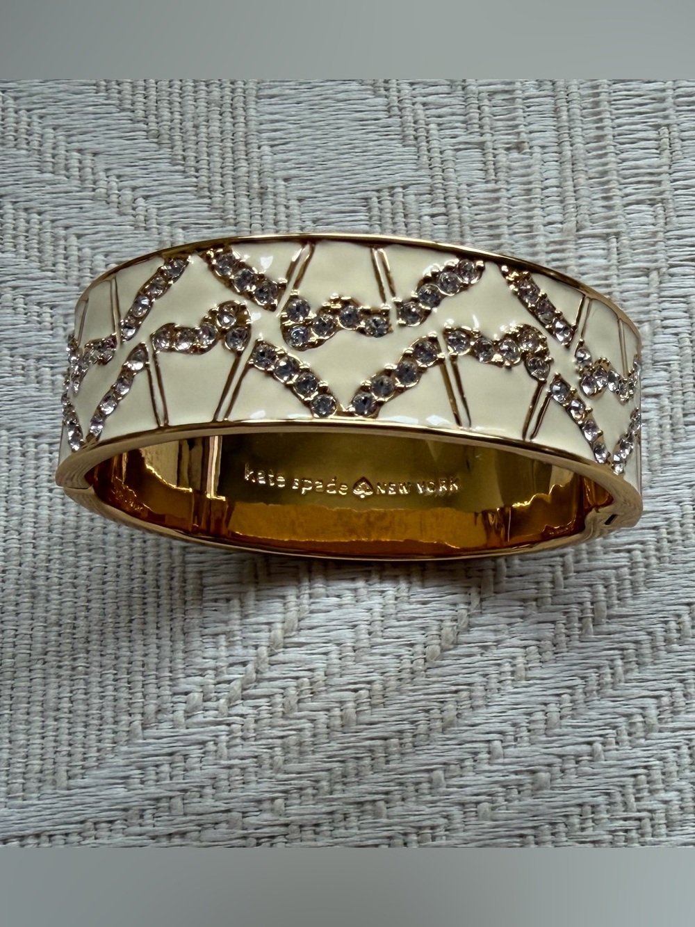 kate spade Gold-Tone Cream Enamel Bangle with Crystal Detailing